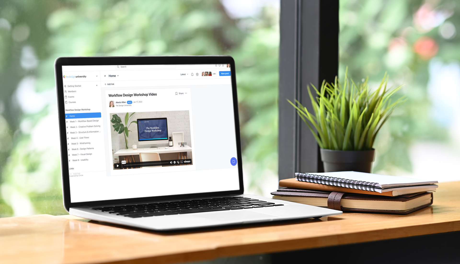 mockup of a macbook placed by an indoor plant